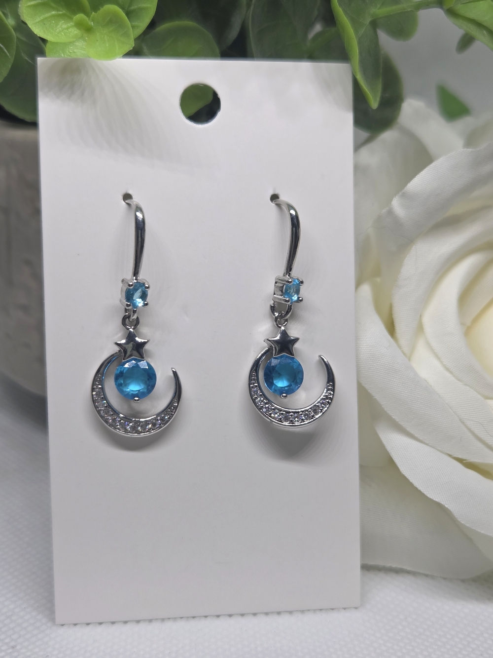 Silver Crescent Moon & Star Drop Earrings with Blue Gem